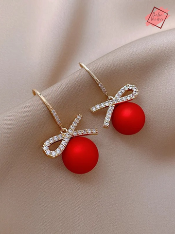 Unwrap the Sparkle: Christmas Earrings with Red Heart Zircon