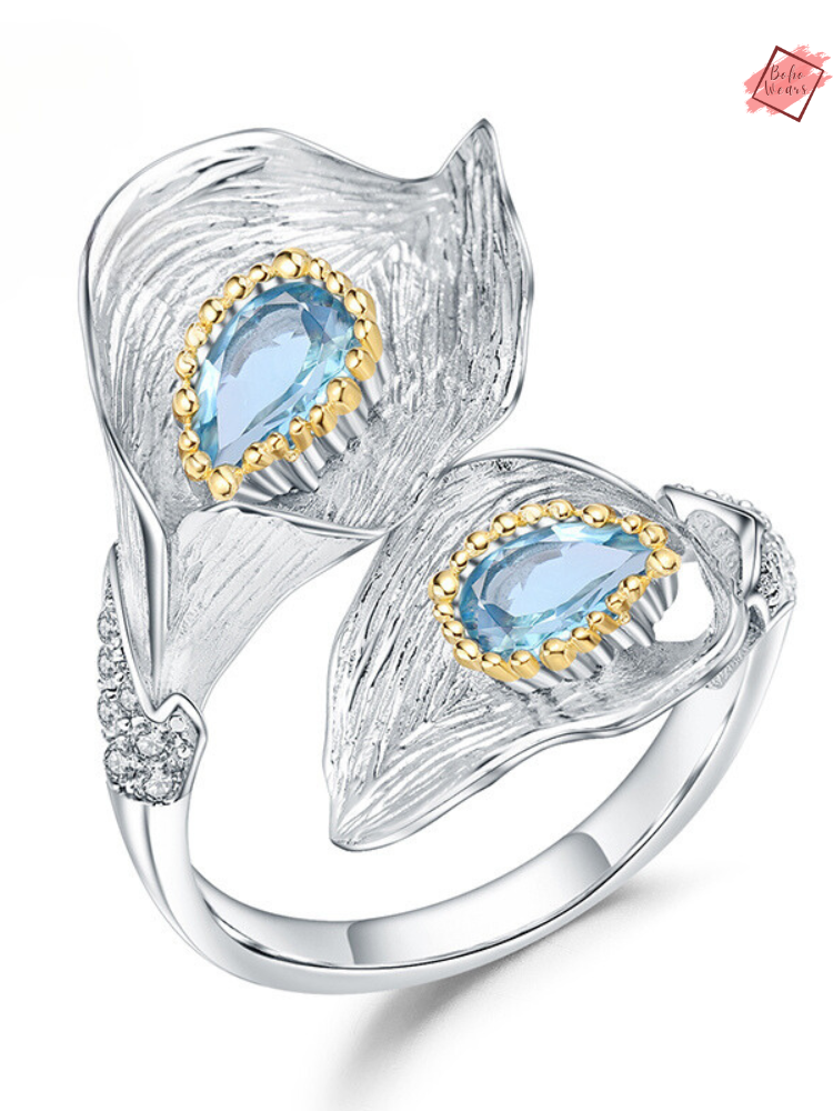 Elevate Your Elegance with the 1.25C Natural Swiss Blue Topaz Calla Lily Leaf Ring